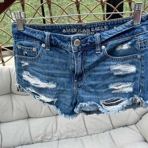 American Eagle mid rise ripped shorts size 0.